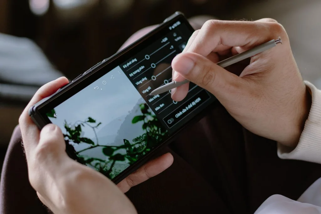 Collection of smartphone screens showing different photo editing apps, arranged on wooden table surface with good natural lighting, each screen displaying background removal interface, bird
