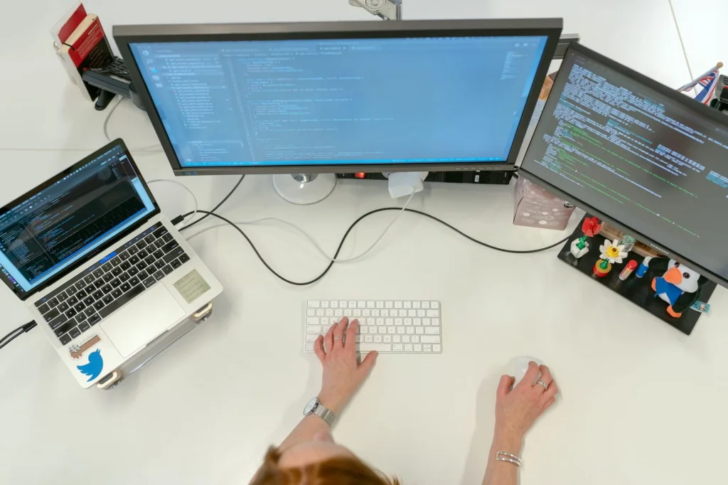 Split-screen comparison showing the same portrait photo with original cluttered background on left and cleanly removed transparent background on right, displayed on a modern monitor, professional photo editing workspace, balanced studio lighting, straight-on medium shot, commercial photography comparison, crisp detail