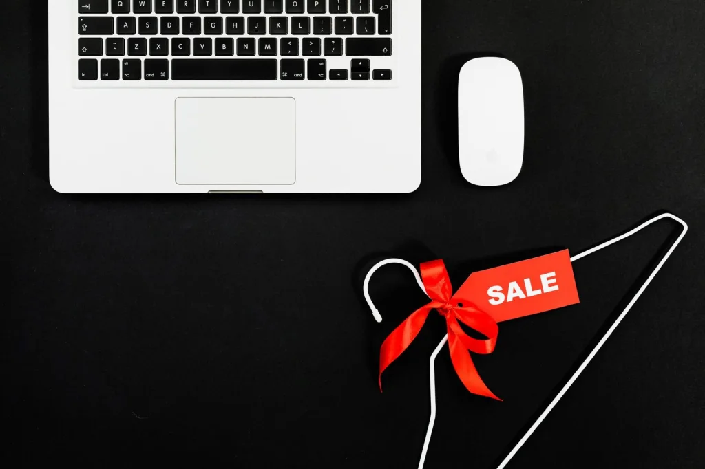 Flat lay of various e-commerce products on white background including smartphone, sunglasses, watch and cosmetics, each with perfectly removed background showing transparency, bright studio lighting from above, product photography style