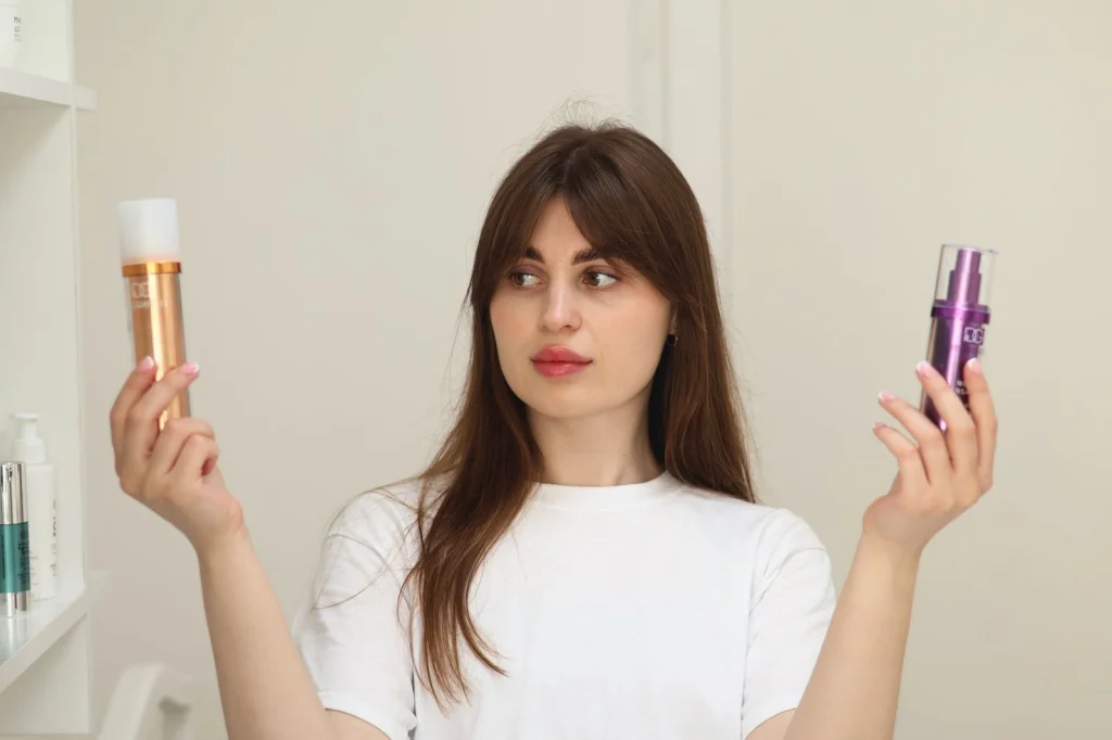 Before and after comparison showing woman in her 30s with natural makeup, same pose and lighting, left side showing original selfie, right side showing AI-enhanced version with improved skin and lighting, studio lighting setup, split-screen composition, commercial photography style