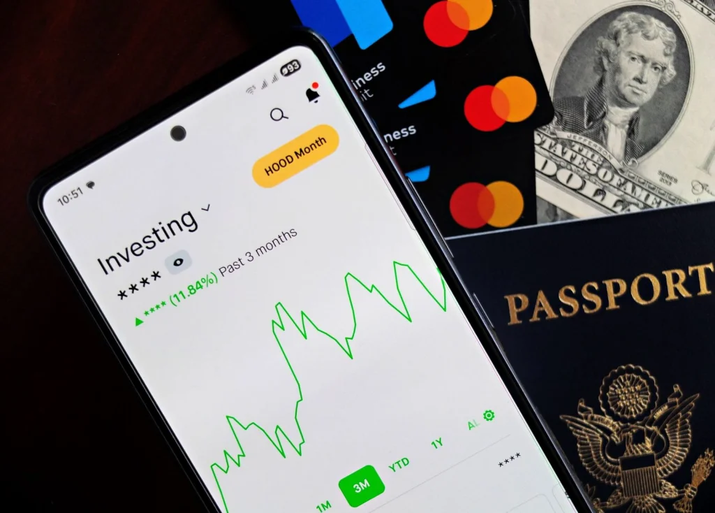 Smartphone held horizontally showing passport photo app interface with woman